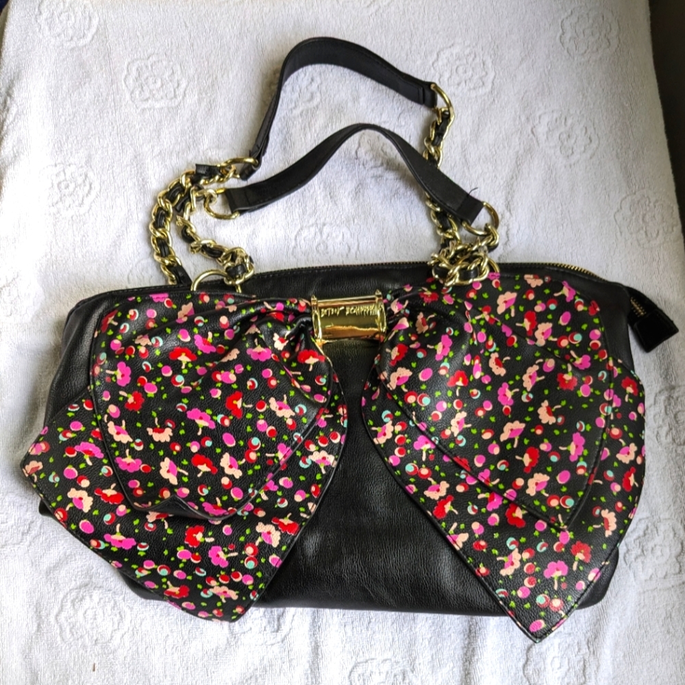 Betsy Johnson black and pink floral bow hand bag.